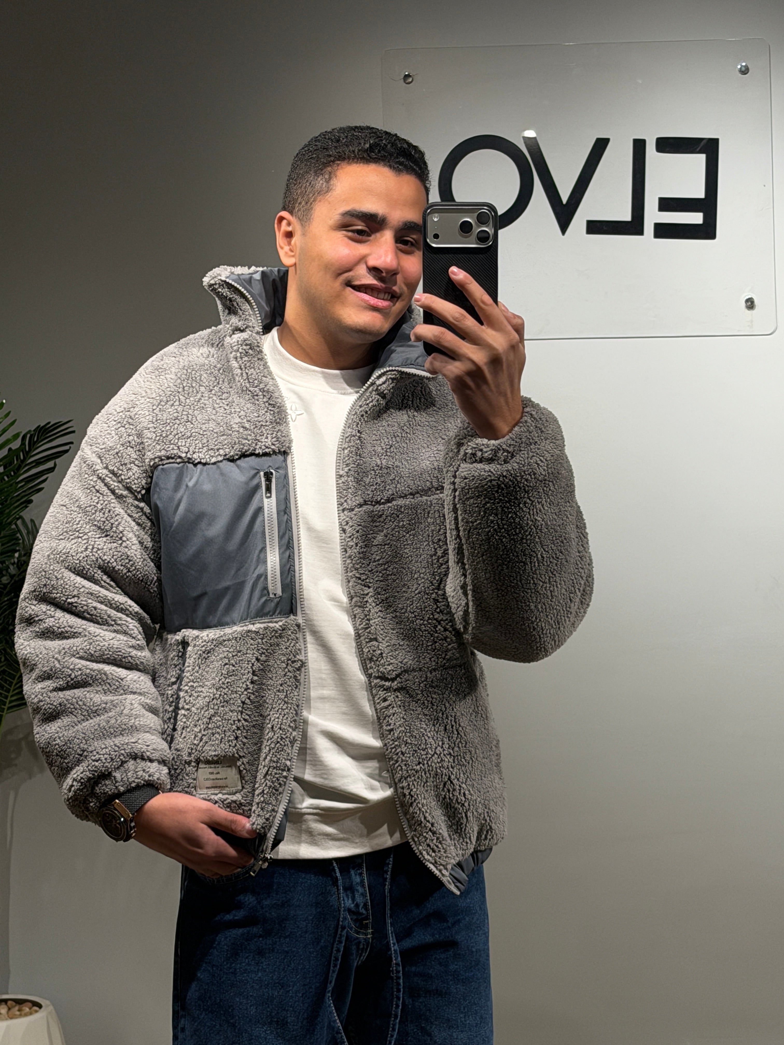 jacket features a soft sherpa texture with contrast