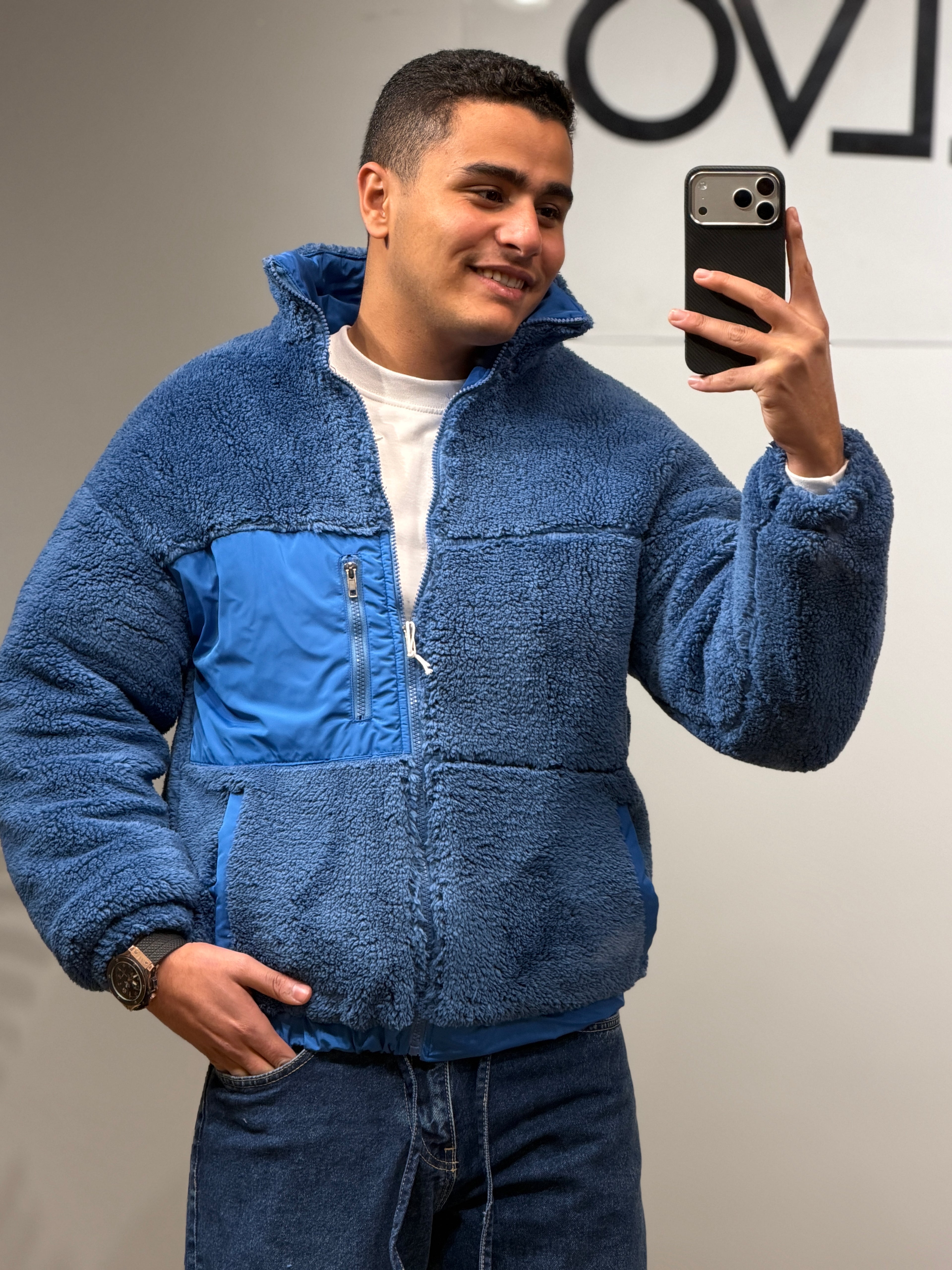 jacket features a soft sherpa texture with contrast