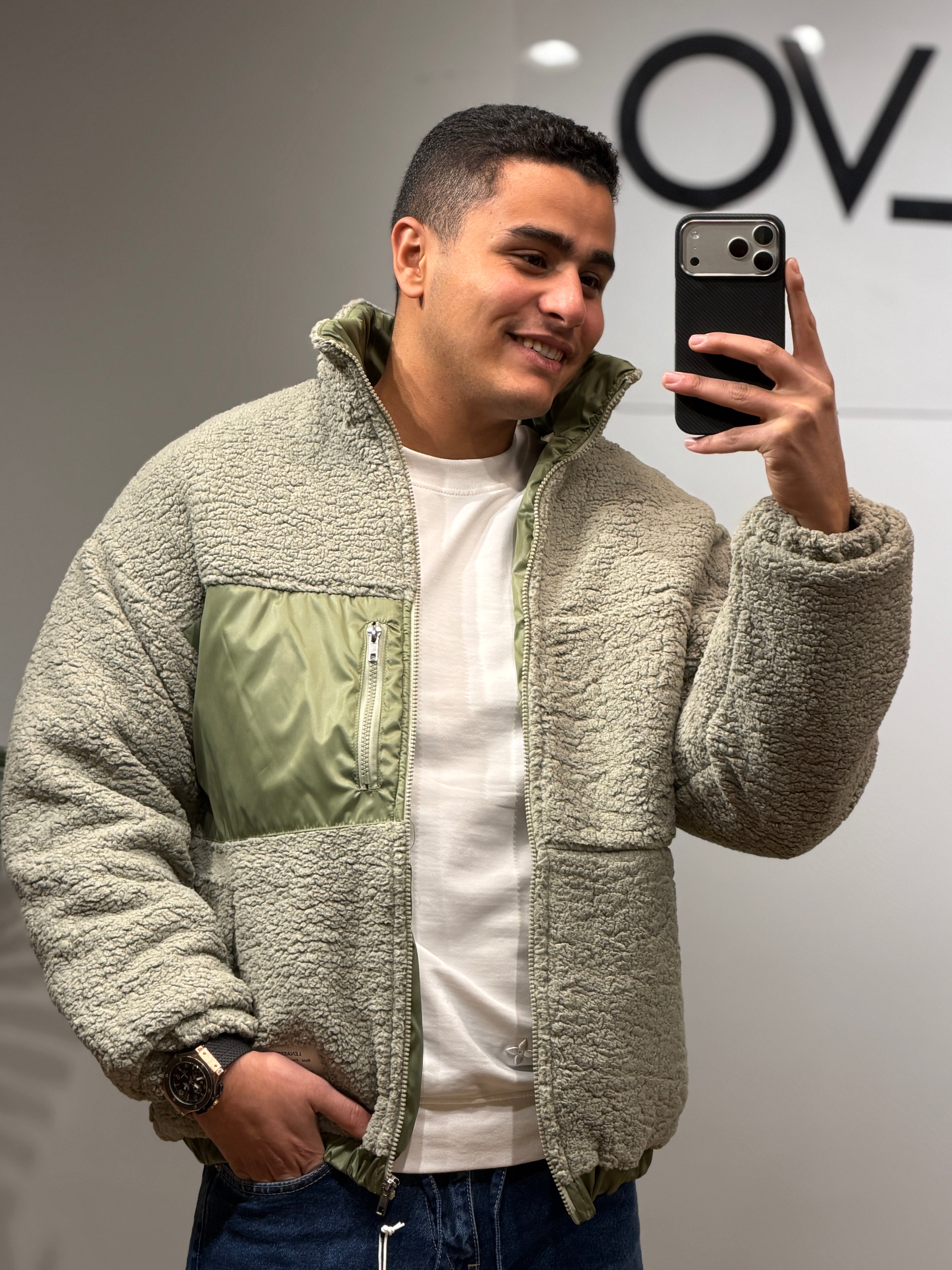 jacket features a soft sherpa texture with contrast